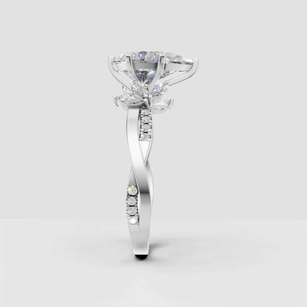 Pear shaped diamond ring with marquise diamonds surrounding canter stone