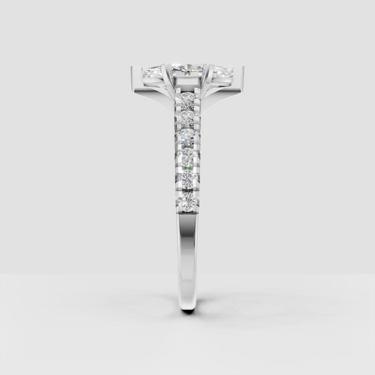 Yellow gold marquise ring with elongated center stone and round diamond accents