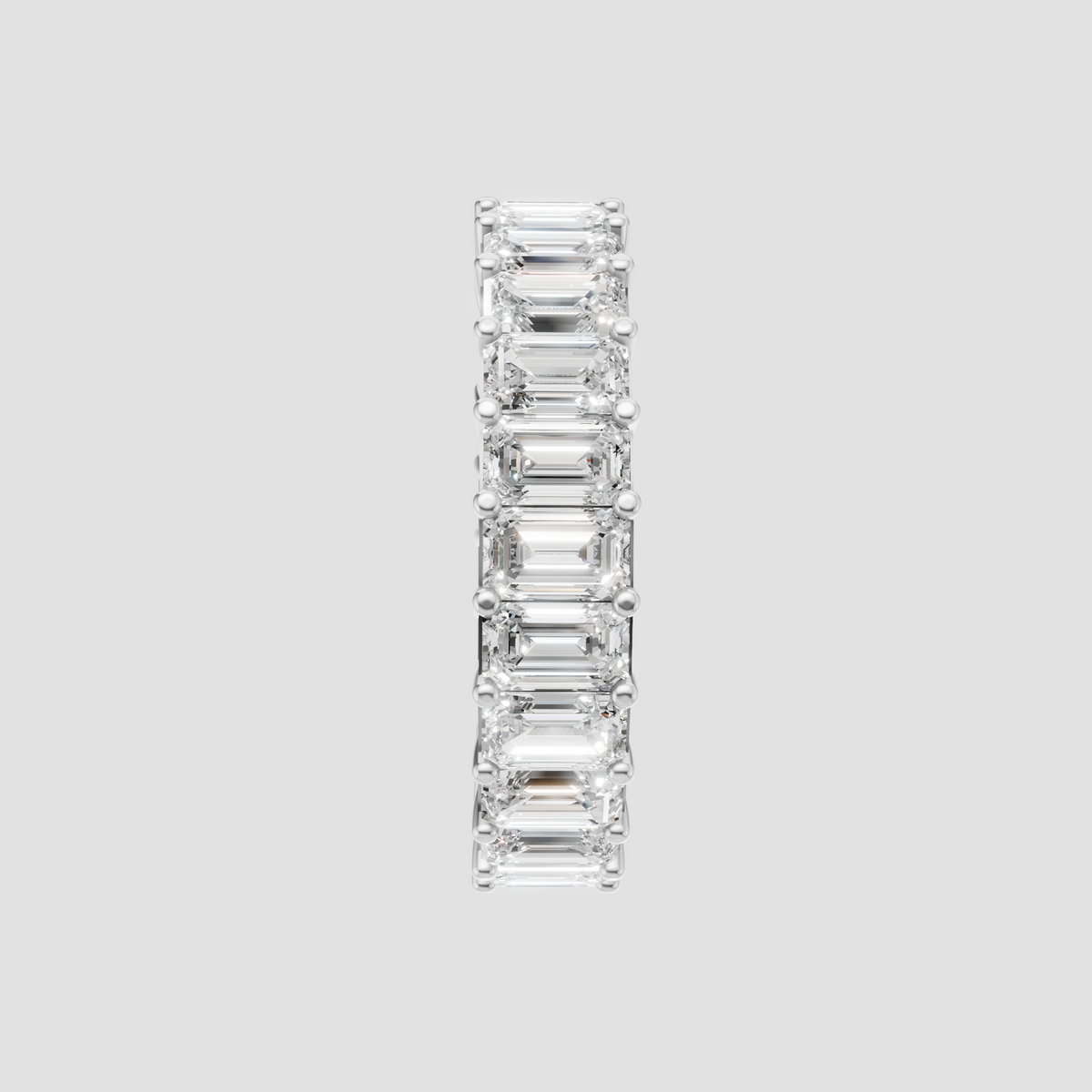 Emerald cut eternity wedding ring with polished yellow gold