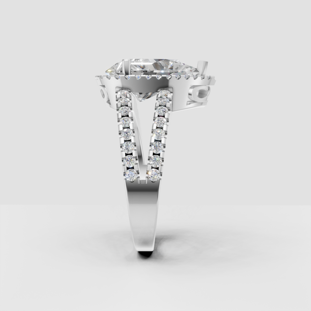 Elegant pear diamond halo ring with polished yellow gold setting