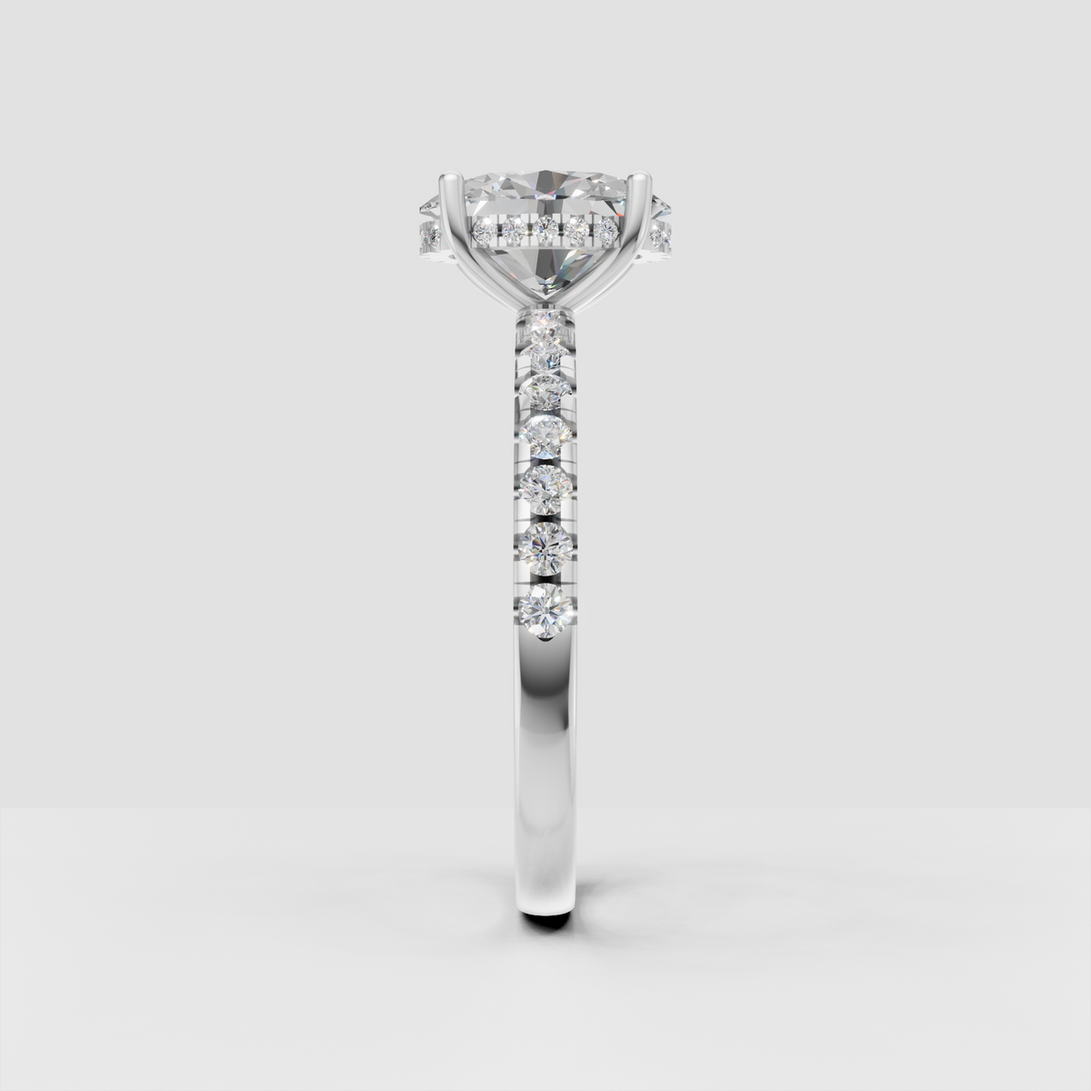 Four prong oval diamond engagement ring yellow gold
