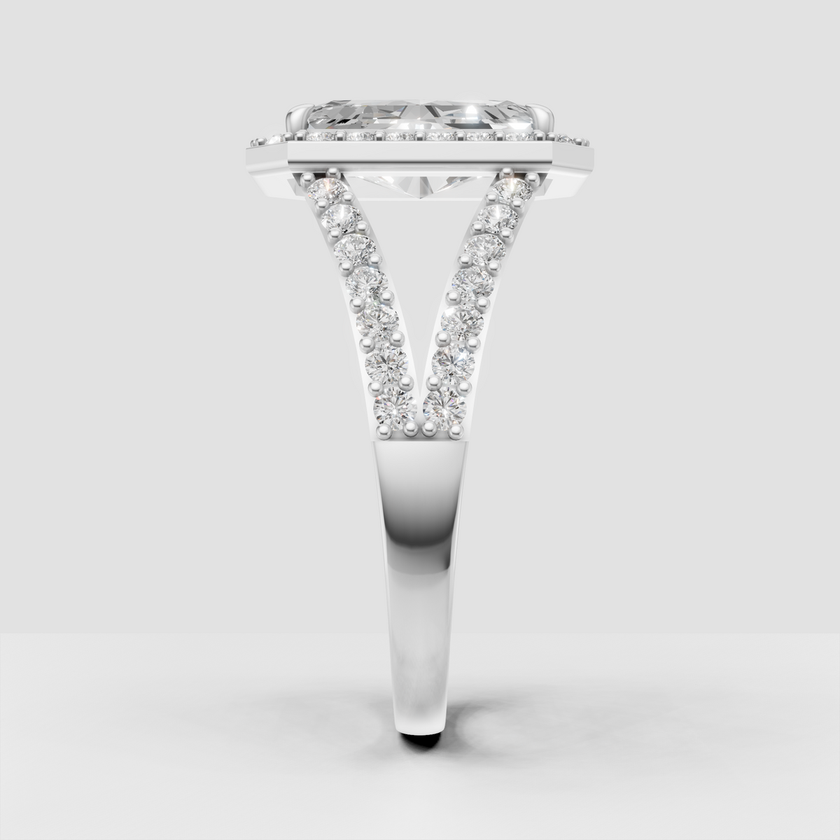 Radiant canter diamond surrounded by a detailed diamond halo