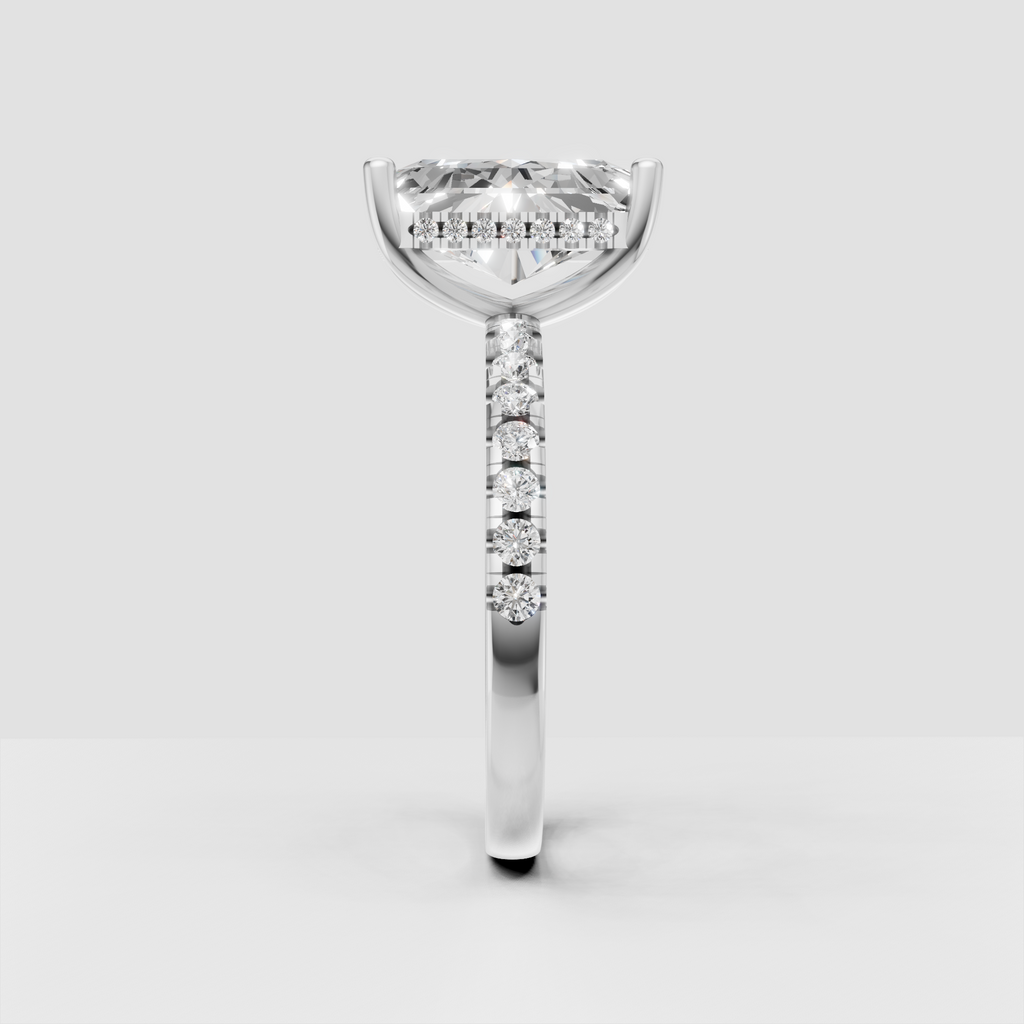 Radiant cut center diamond in four-prong yellow gold setting