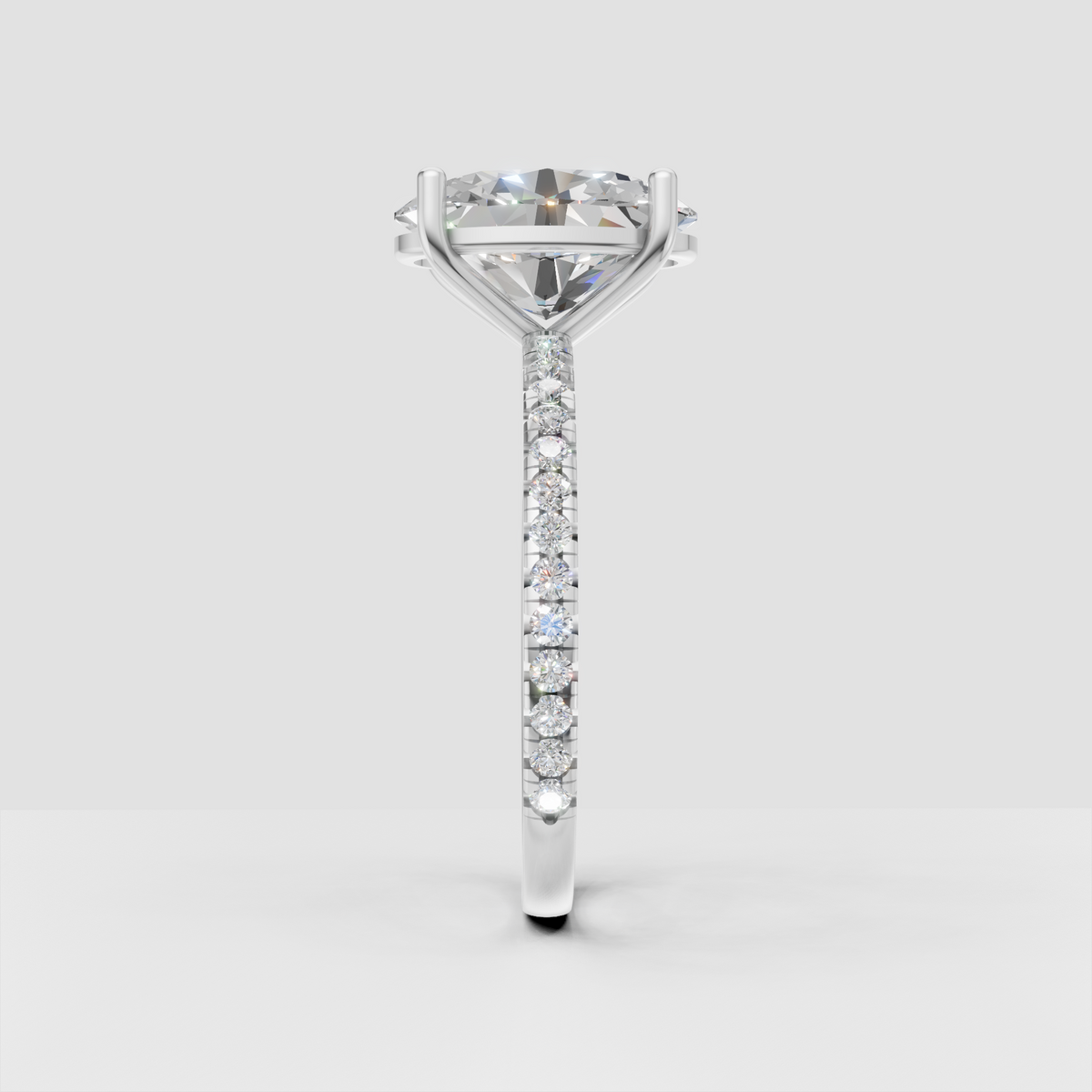 Oval center diamond ring with round pavé accent stones