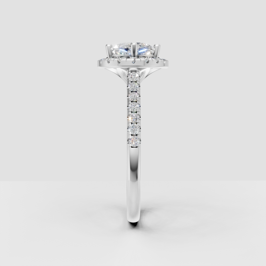 Halo cushion diamond ring with round accent stones surrounding the center