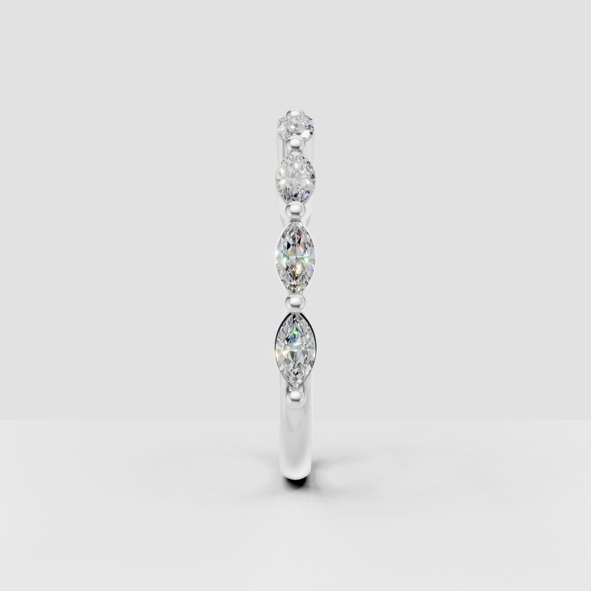 Elegant marquise diamond eternity band with round side stones