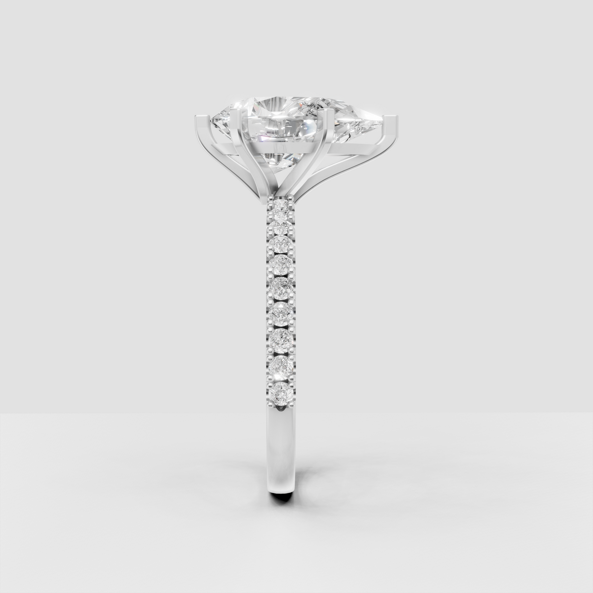 Luxury yellow gold engagement ring with elongated pear center diamond