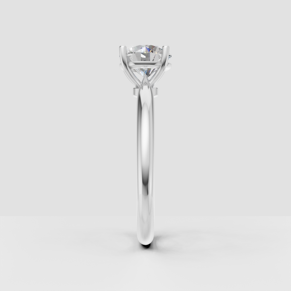 Round diamond solitaire ring with elevated gallery and four prong setting