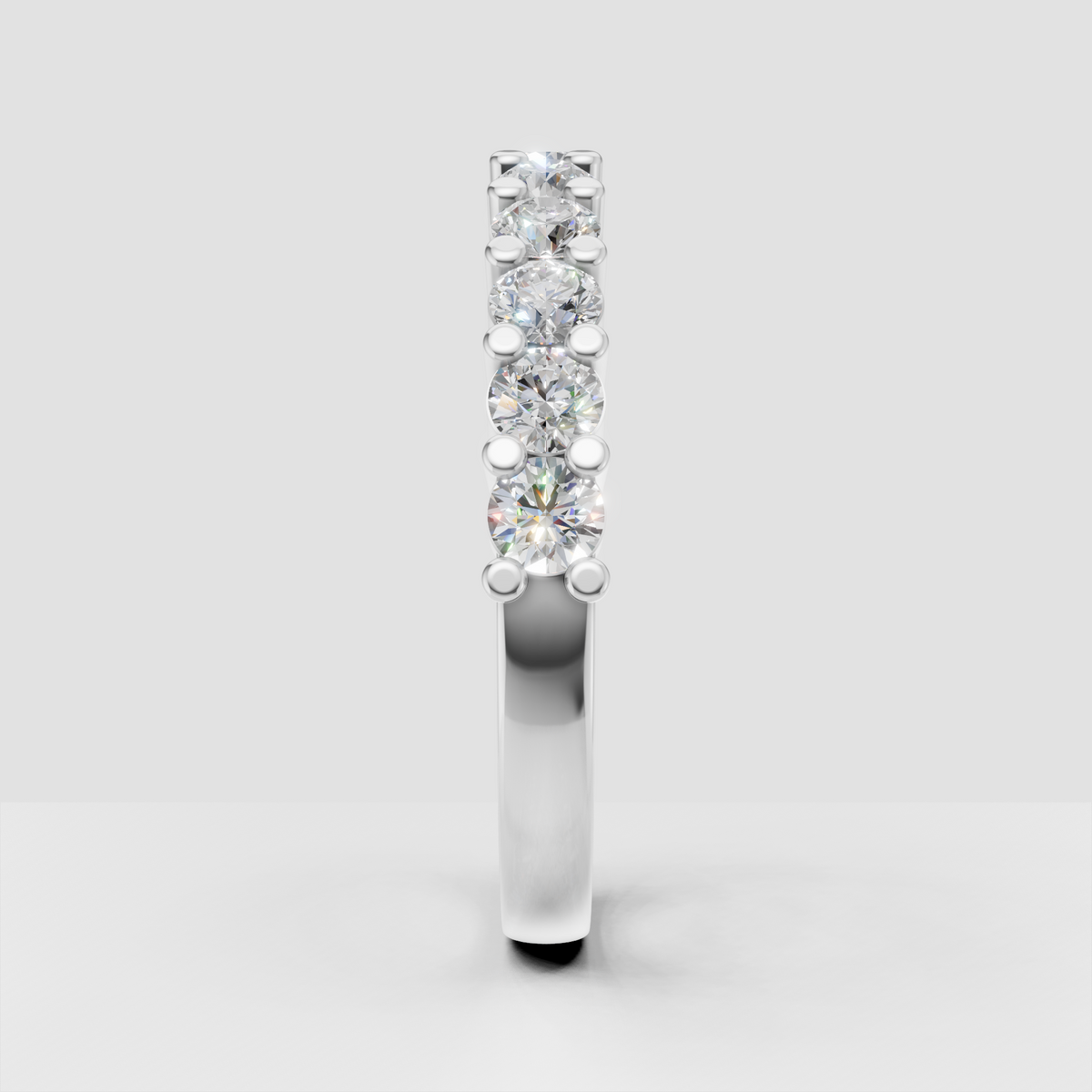 Half eternity wedding band with round diamond accents