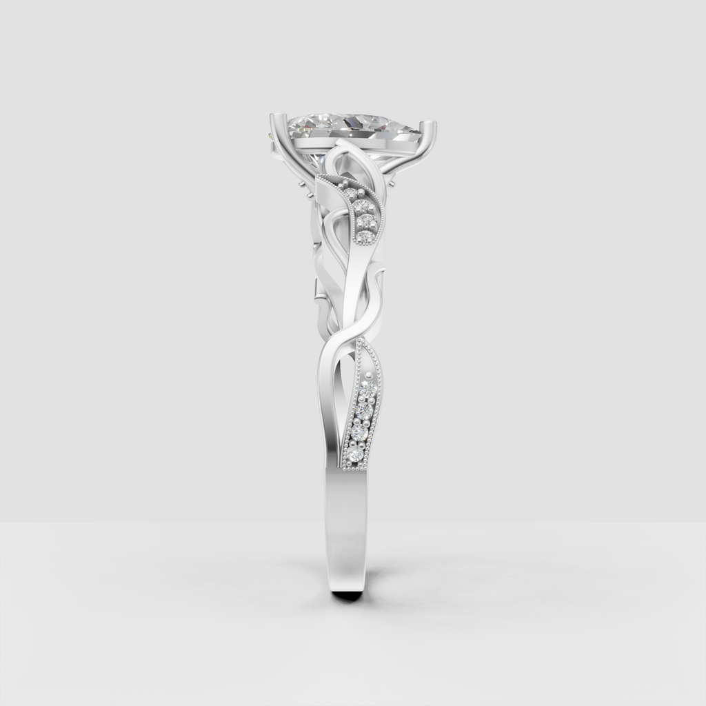 Pear cut solitaire diamond ring with vintage scrollwork details