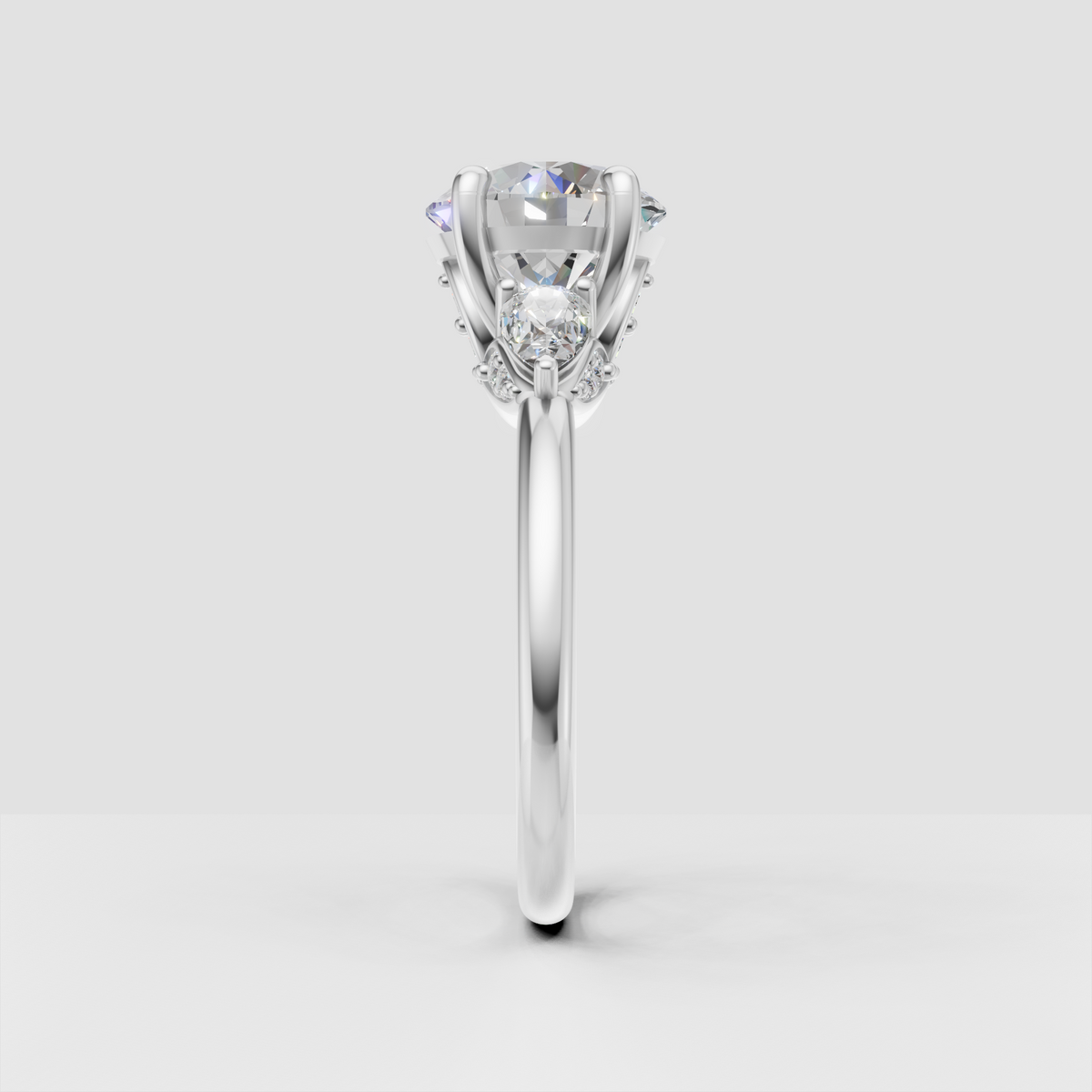 Round diamond prong setting ring with botanical details
