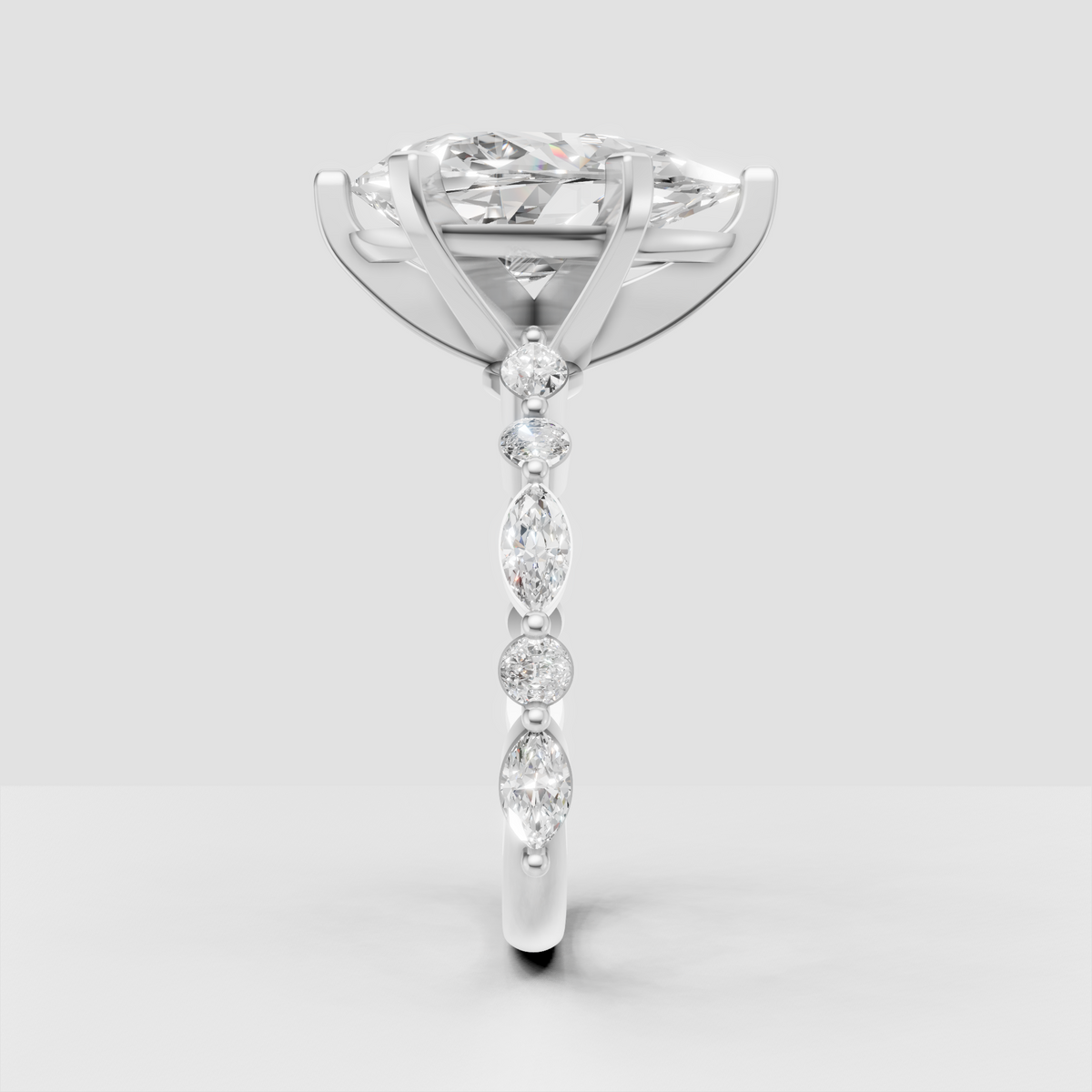Pear center stone engagement ring with elegant open gallery
