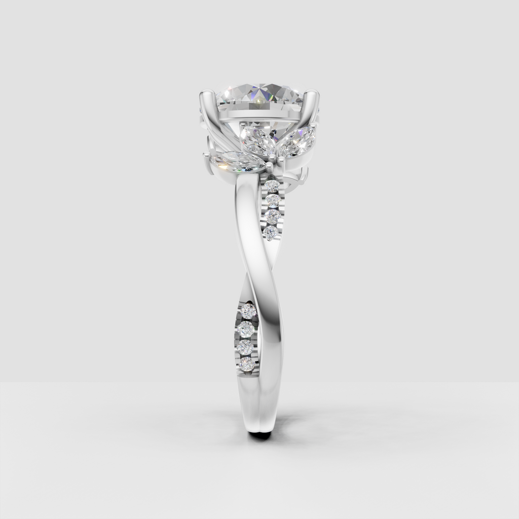 Round diamond ring featuring four rounded prongs and floral-inspired accents