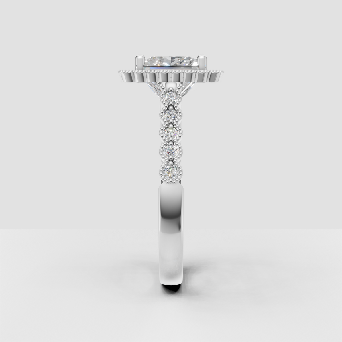 Elegant princess cut diamond ring with round accent stones and milgrain detail