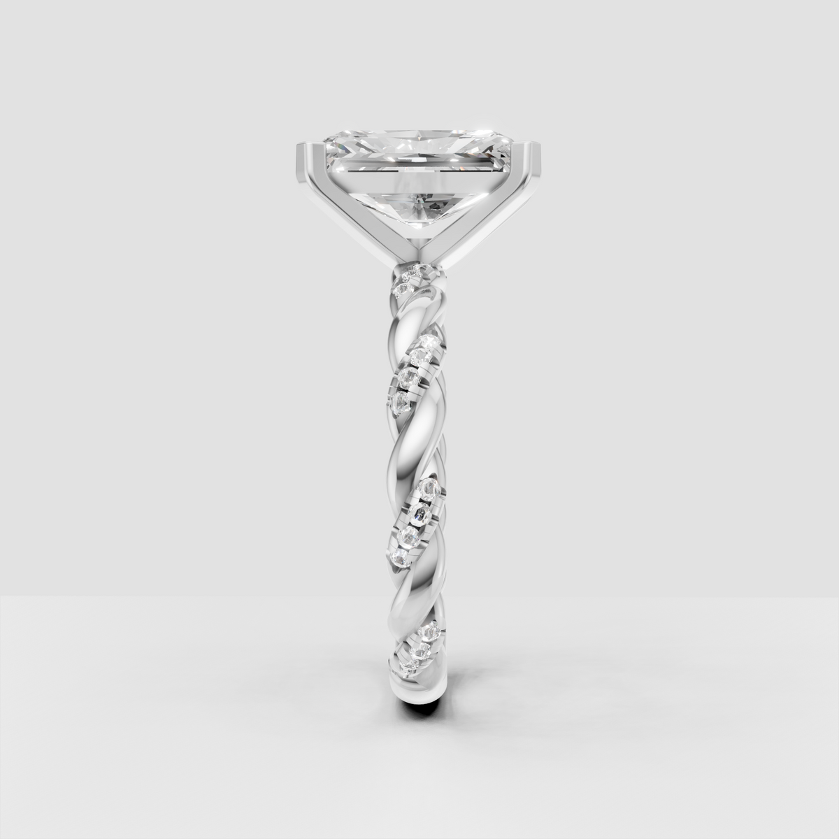 Luxury radiant diamond ring with twisted pavé gold shoulders