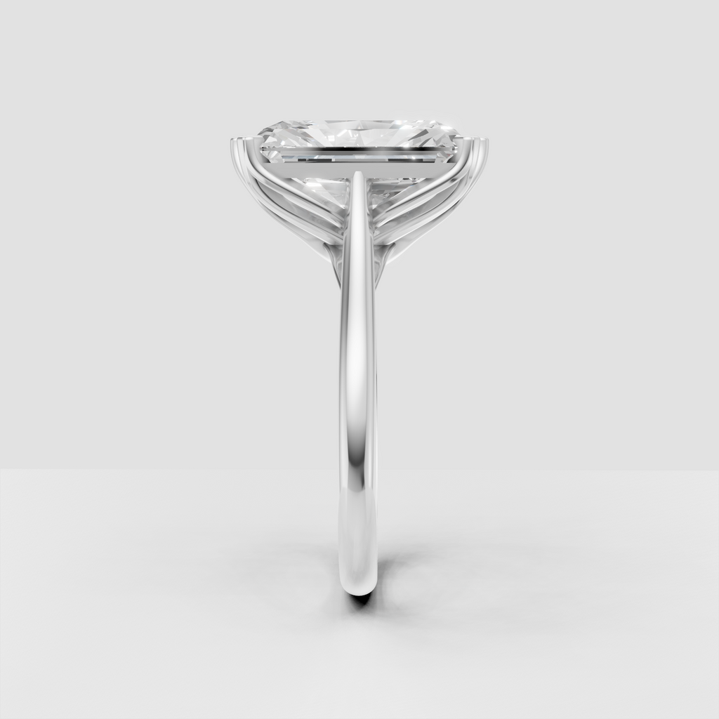 Radiant cut diamond secured by sculpted yellow gold prongs