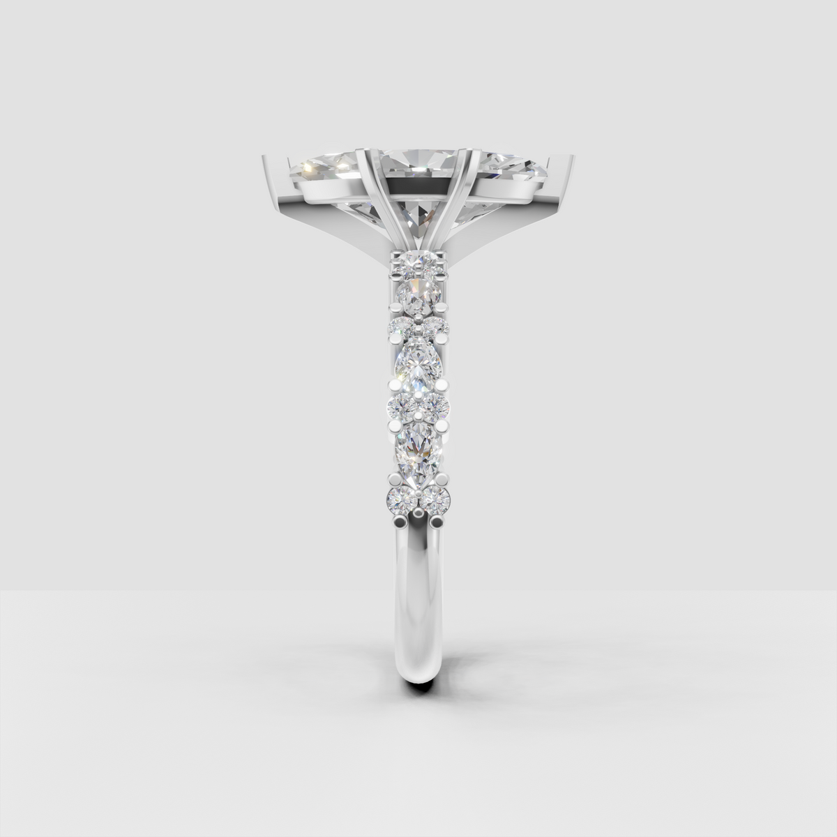 Marquise solitaire ring with round and marquise accent diamonds on shoulders
