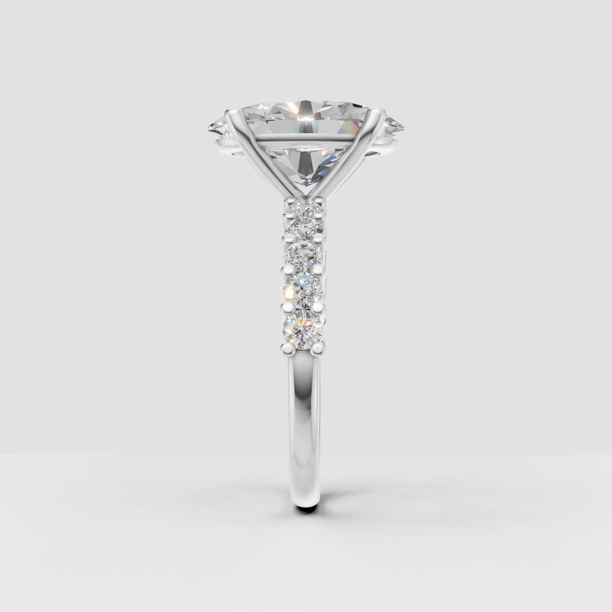 Oval center diamond ring with baguette-cut diamond shoulders