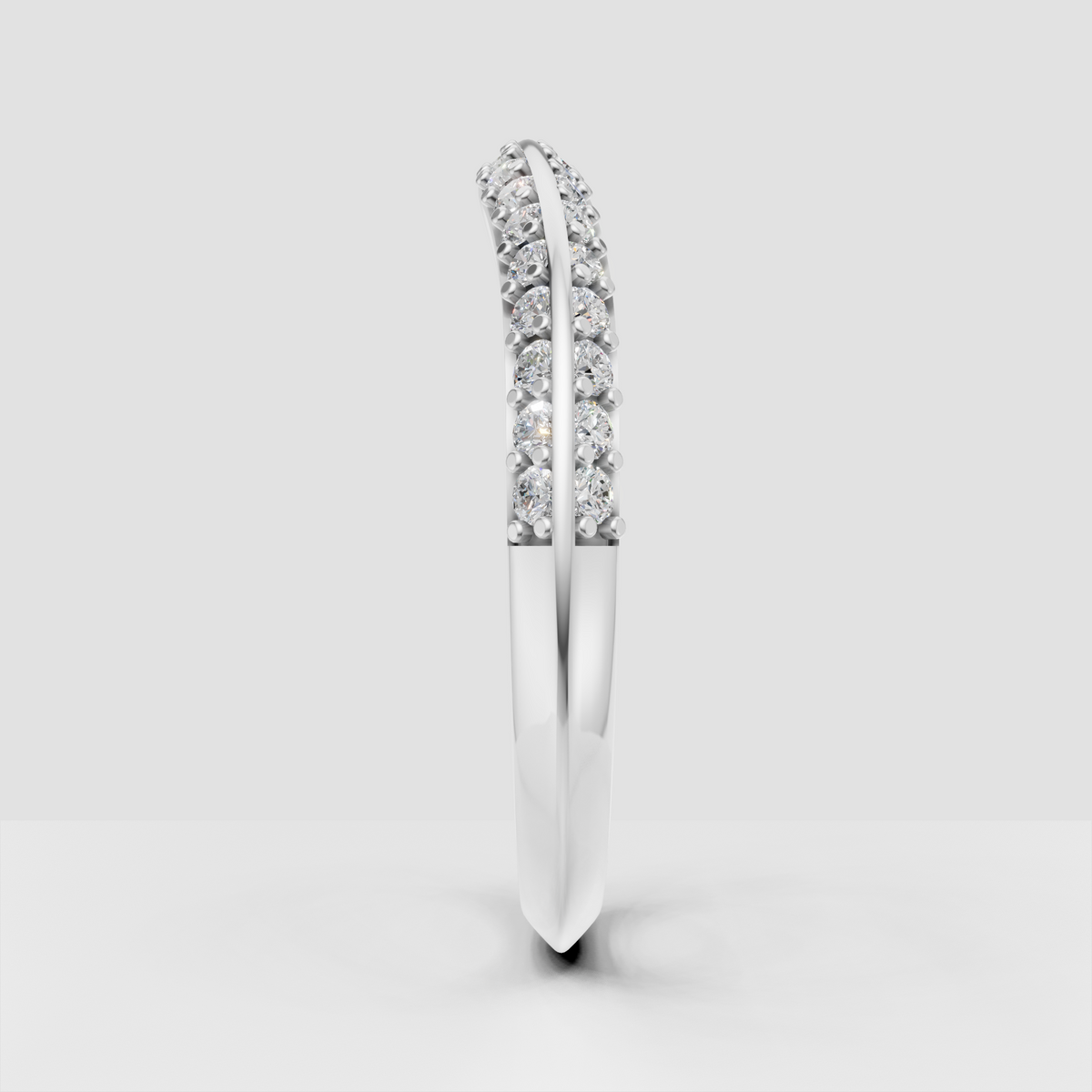 Polished yellow gold curved band with sparkling round stones