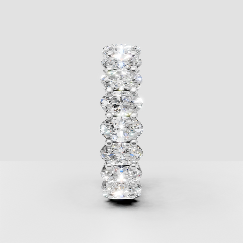Oval cut diamond ring featuring shared prongs