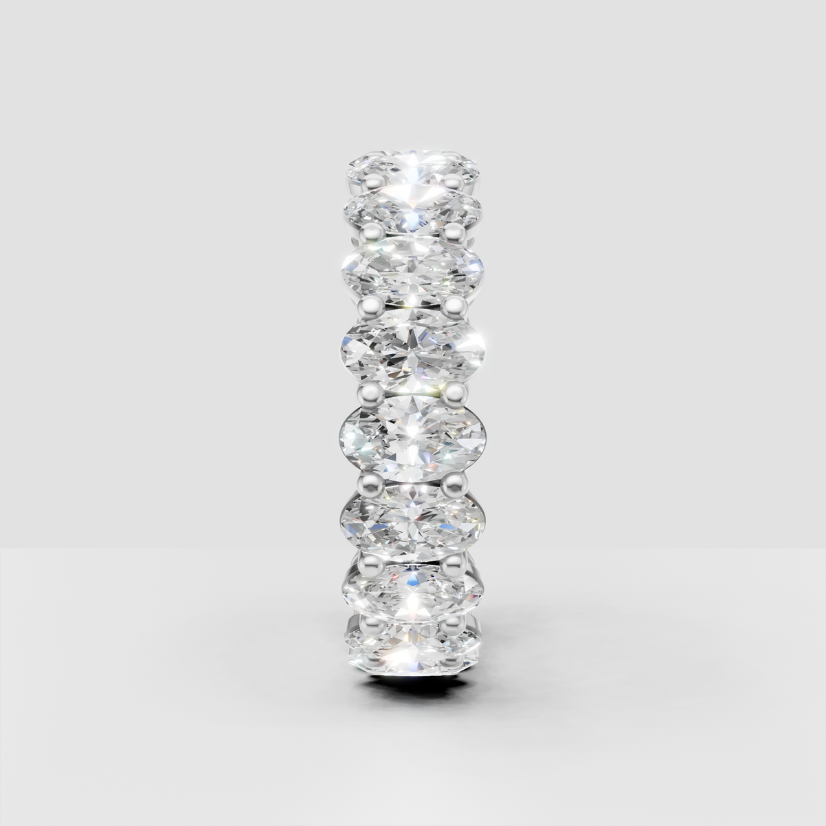 Oval cut diamond ring featuring shared prongs