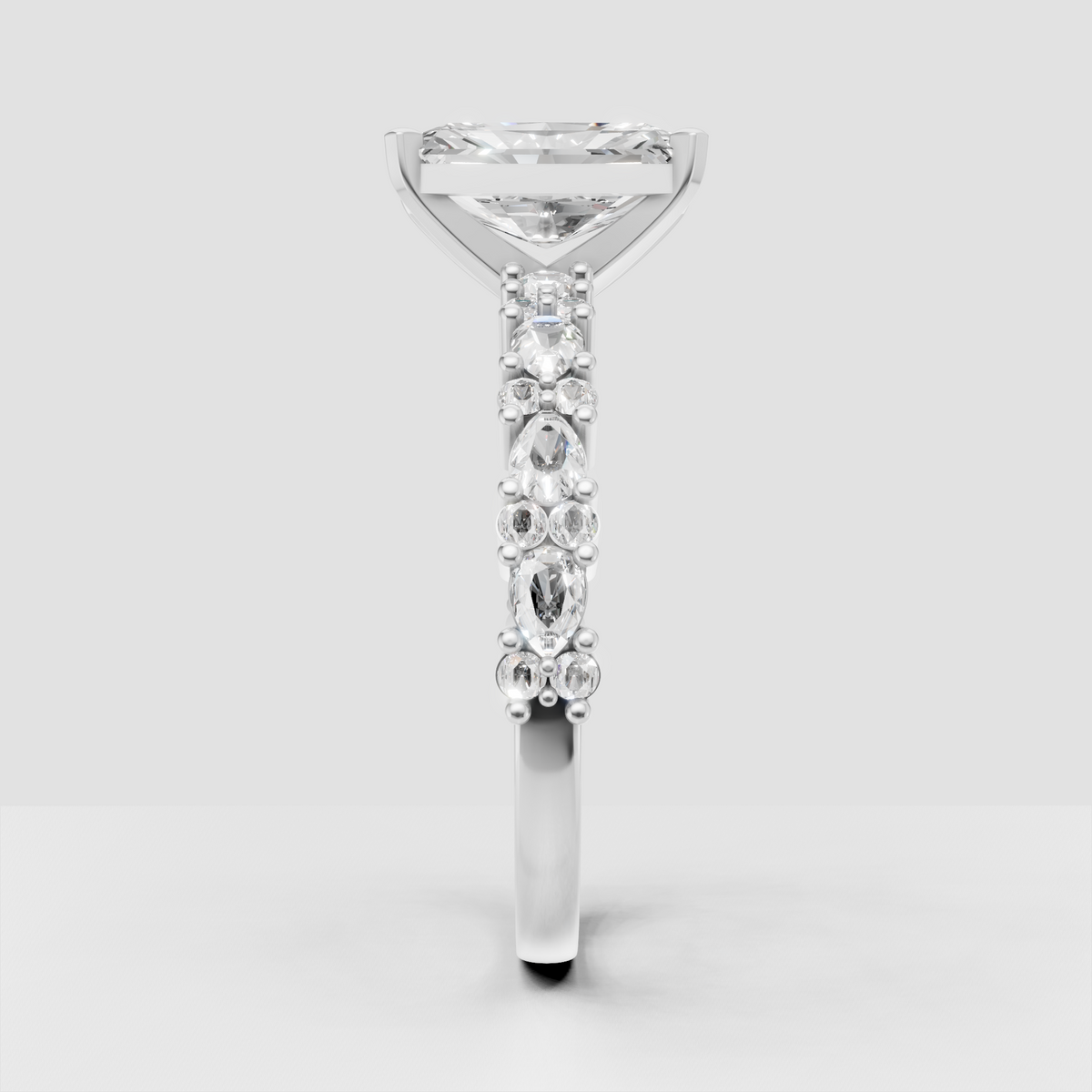 Radiant cut center diamond with sparkling shoulder stones