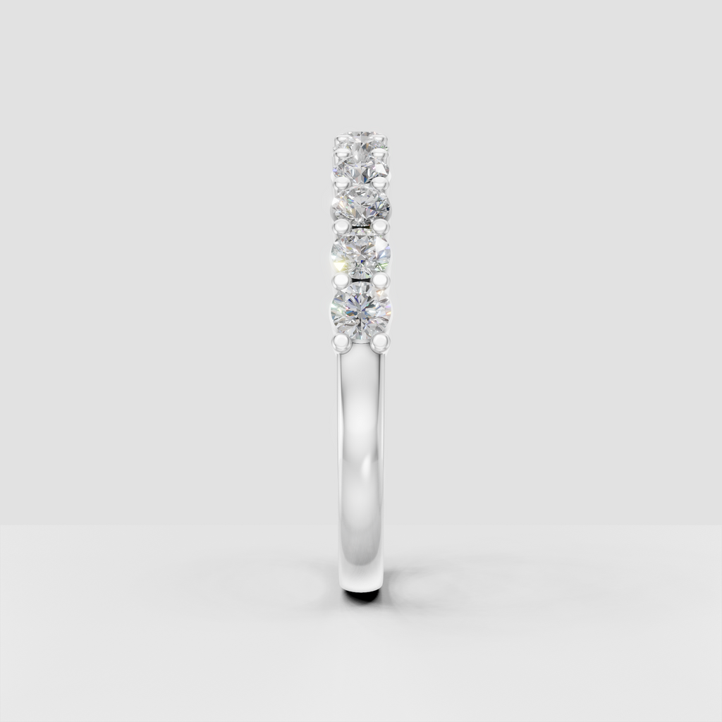 Bead-set round diamond eternity ring with polished gold interior shank