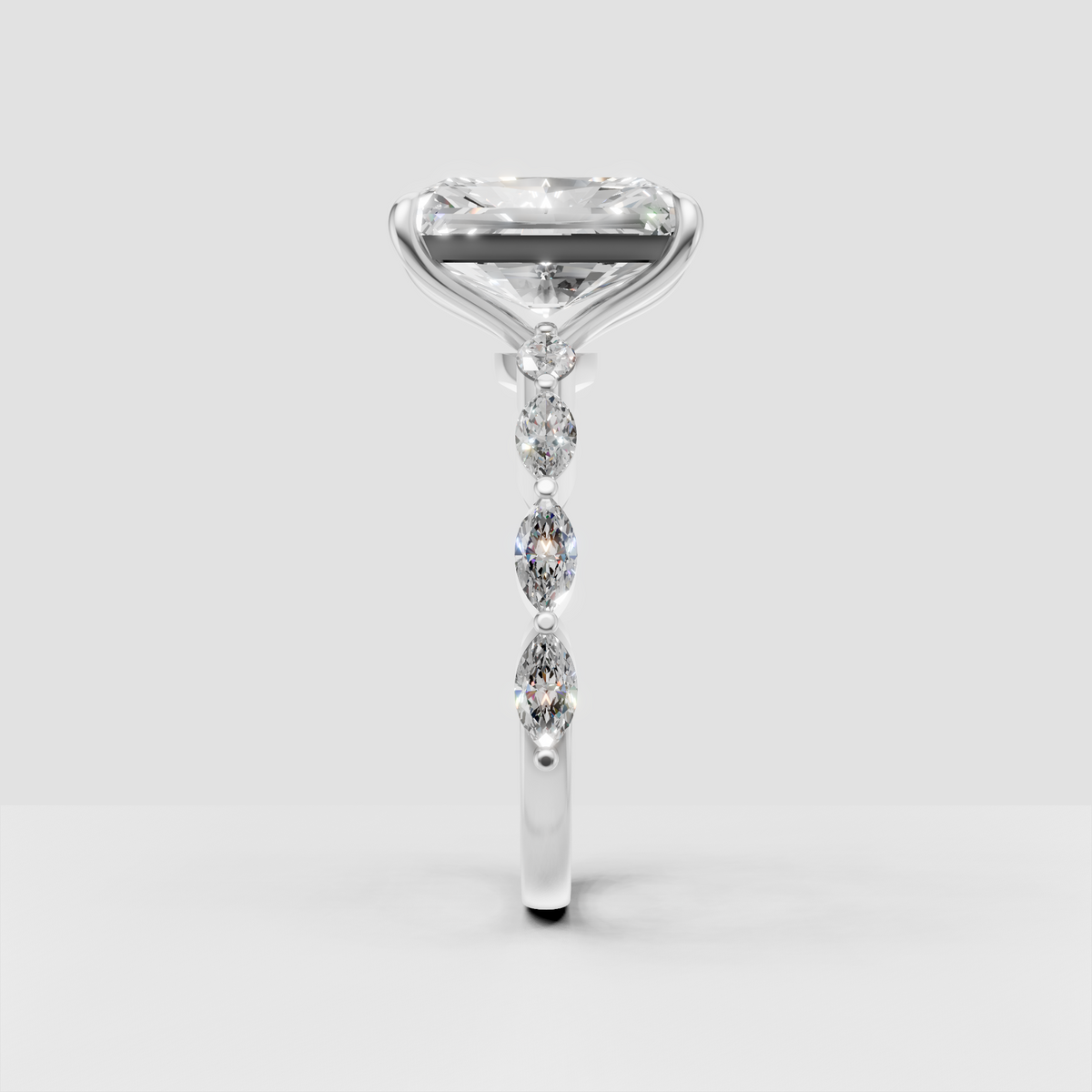 Elongated radiant diamond ring with four-prong setting
