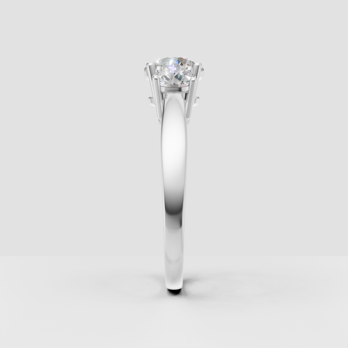 Three-stone Diamond engagement ring with round center and side stones