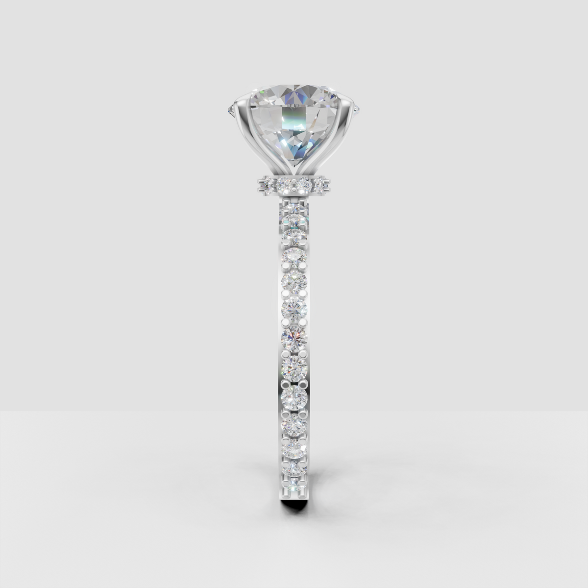 Round diamond wedding ring featuring a slim pavé set gold band