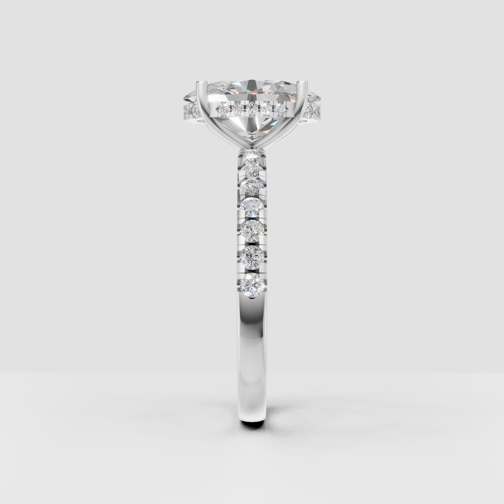 Contemporary pear diamond ring with cathedral profile and sparkling side stones