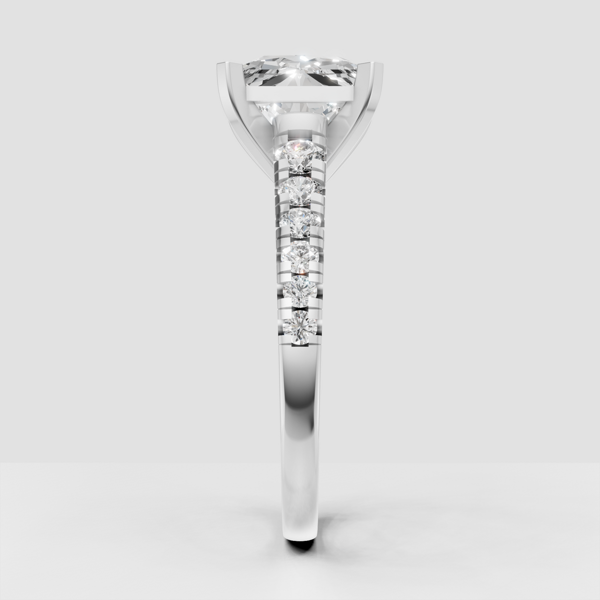 Radiant cut diamond ring with distinctive four-prong center setting