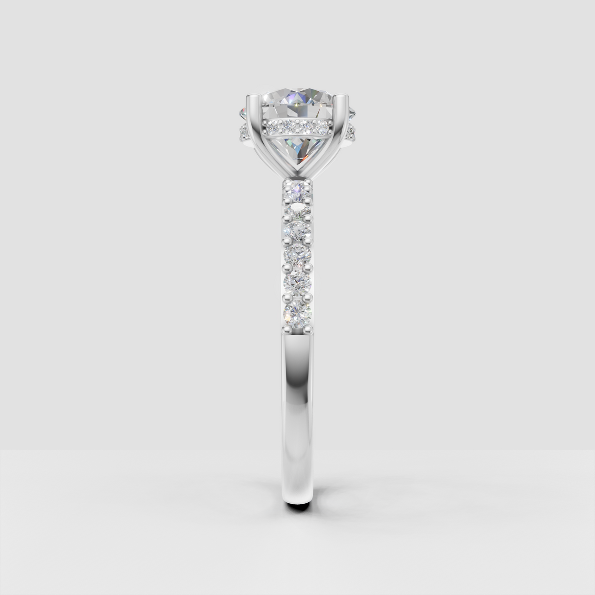 Round diamond cathedral engagement ring with diamond-accented under-gallery