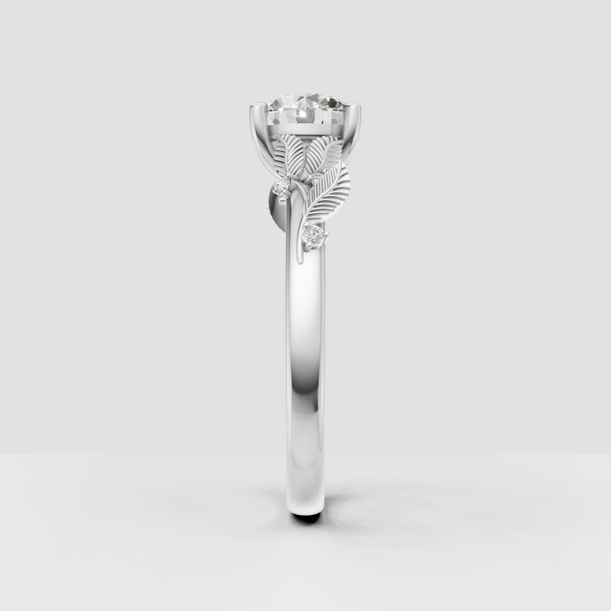 Gold round diamond engagement ring with sculpted leaf accents