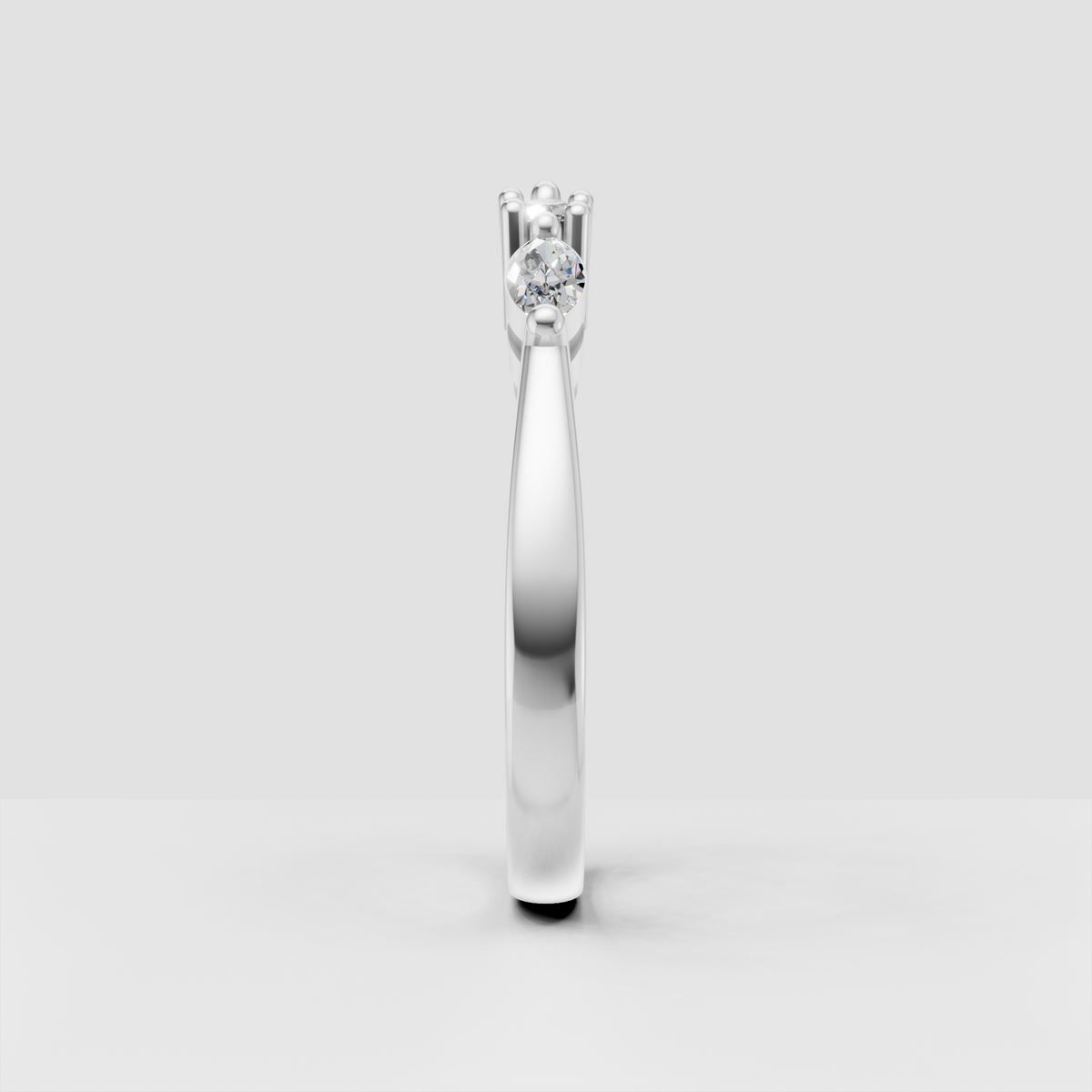 Polished gold marquise engagement ring with symmetrical gemstone layout