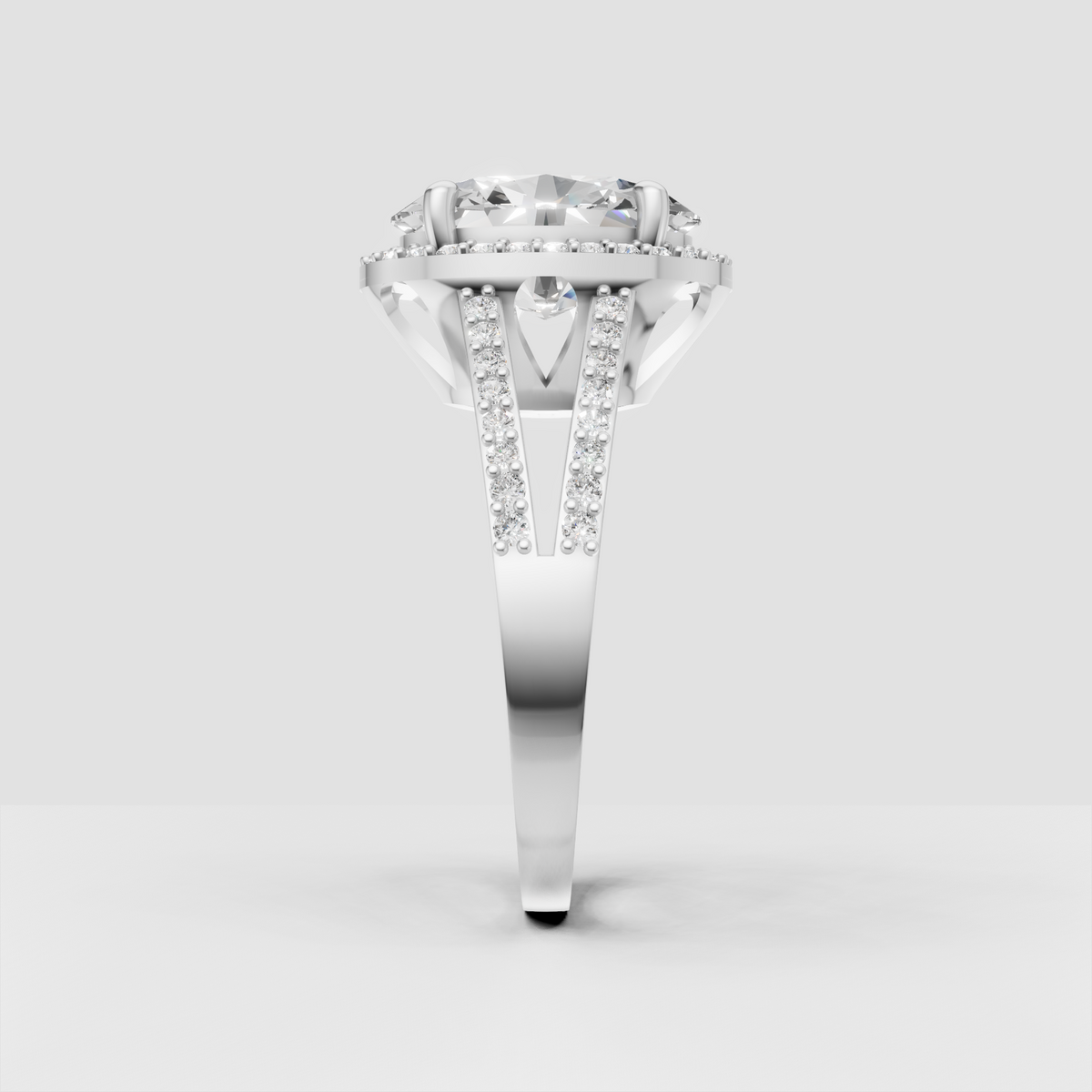 Oval center stone framed by a brilliant halo of round accents.
