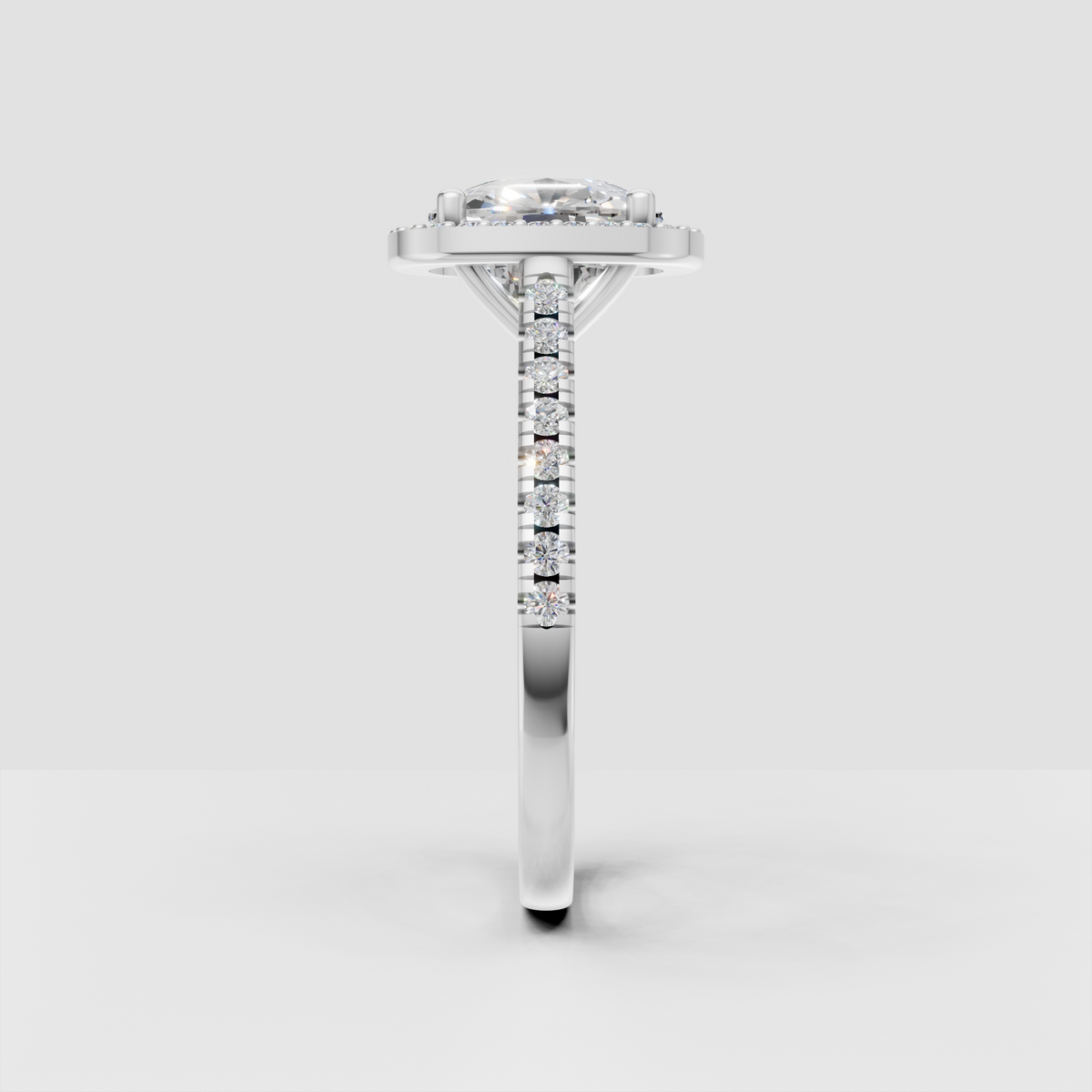 Elegant oval diamond ring with delicate bead halo detailing
