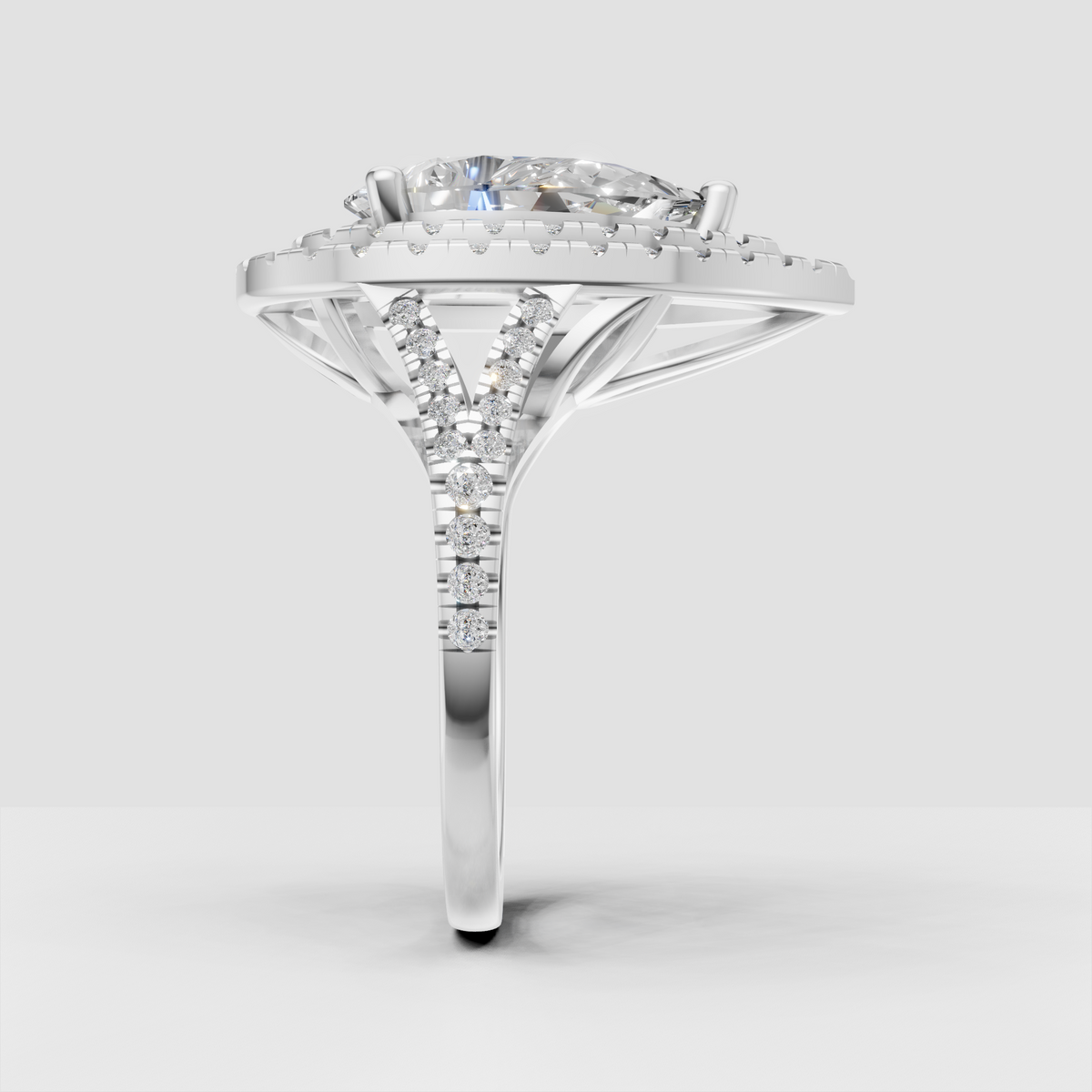 Pear diamond double halo ring with diamond-encrusted split shank
