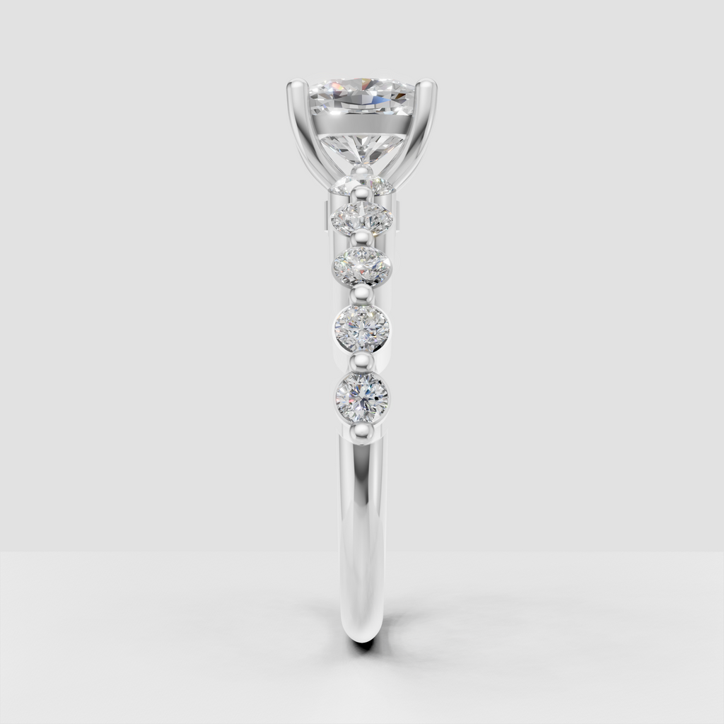 Cushion cut center stone ring with round pavé side diamonds