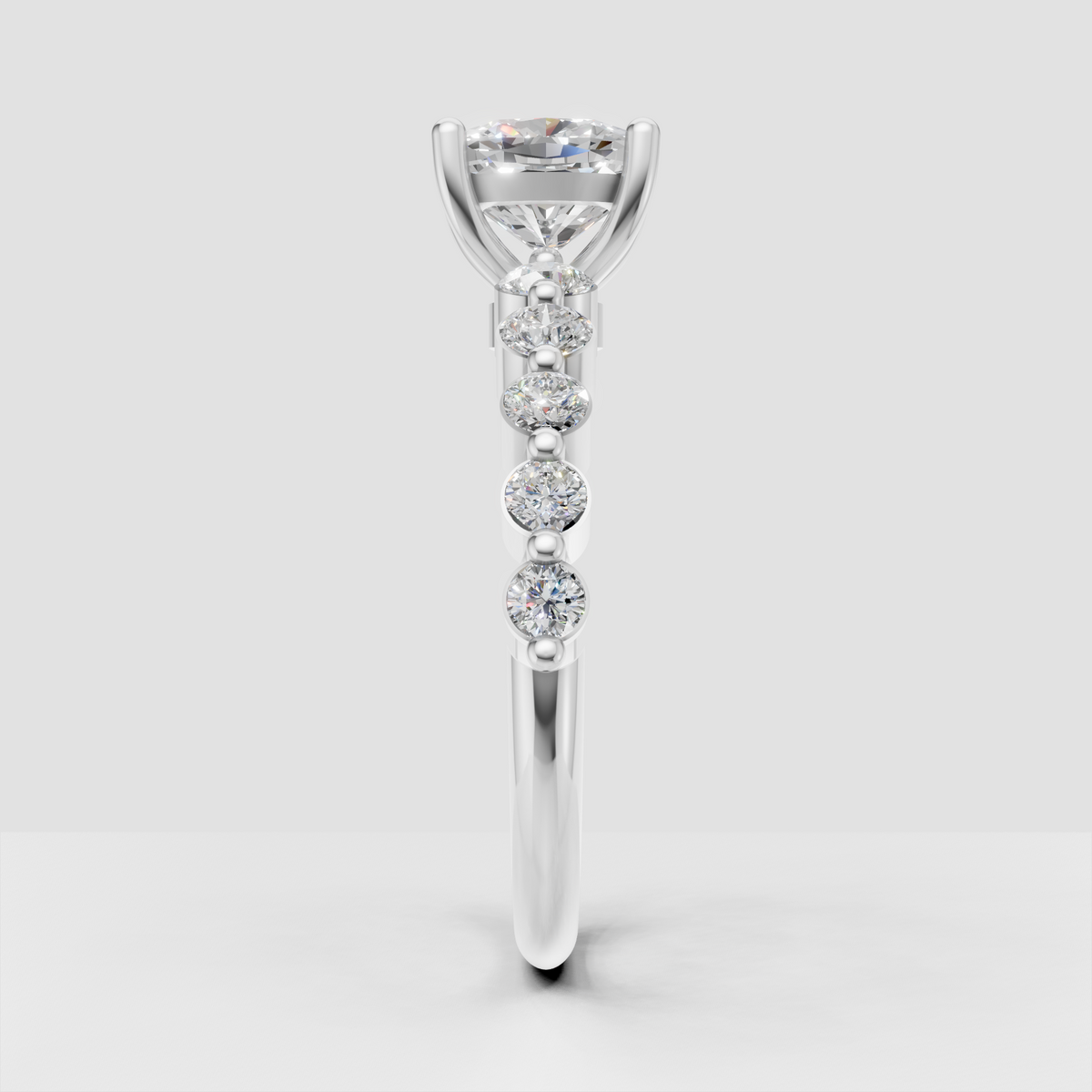 Cushion cut center stone ring with round pavé side diamonds