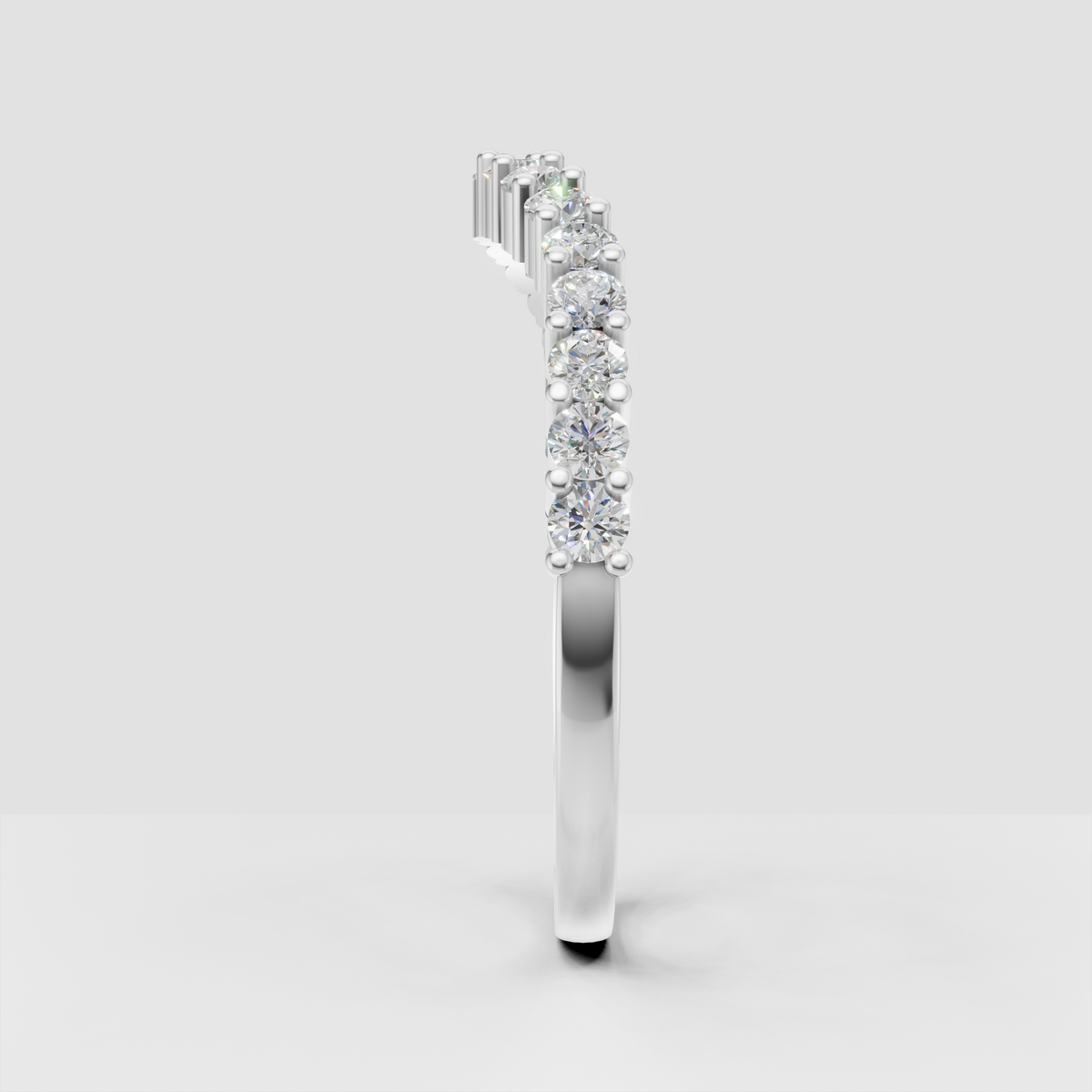 Polished gold half-eternity ring featuring round brilliant stones
