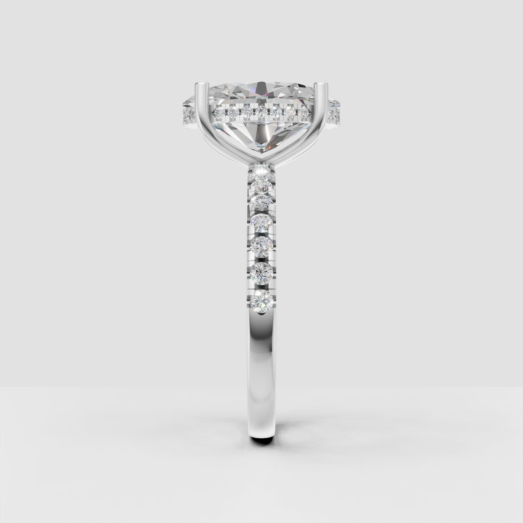 Oval solitaire diamond ring featuring a polished yellow gold band