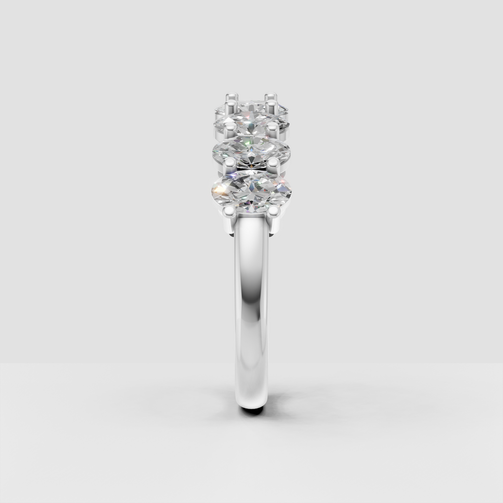 Yellow gold eternity ring featuring a continuous row of oval-cut stones