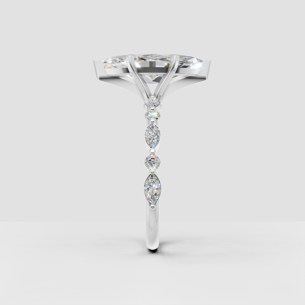 White gold marquise diamond solitaire ring with round and marquise side stones.