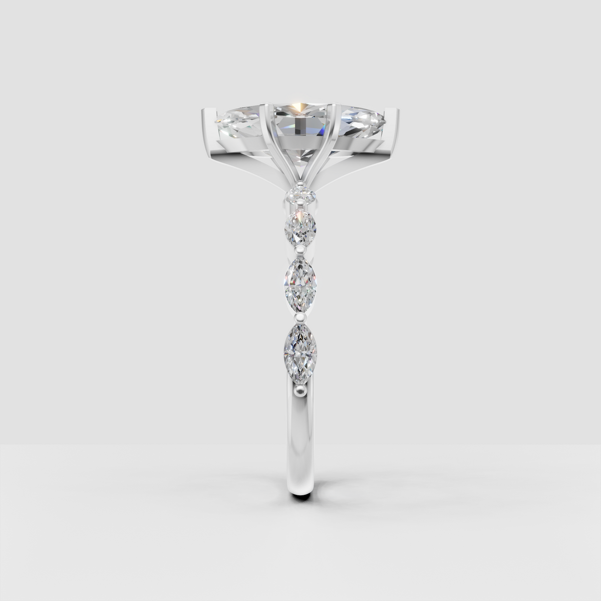 Yellow gold cathedral ring with marquise center diamond