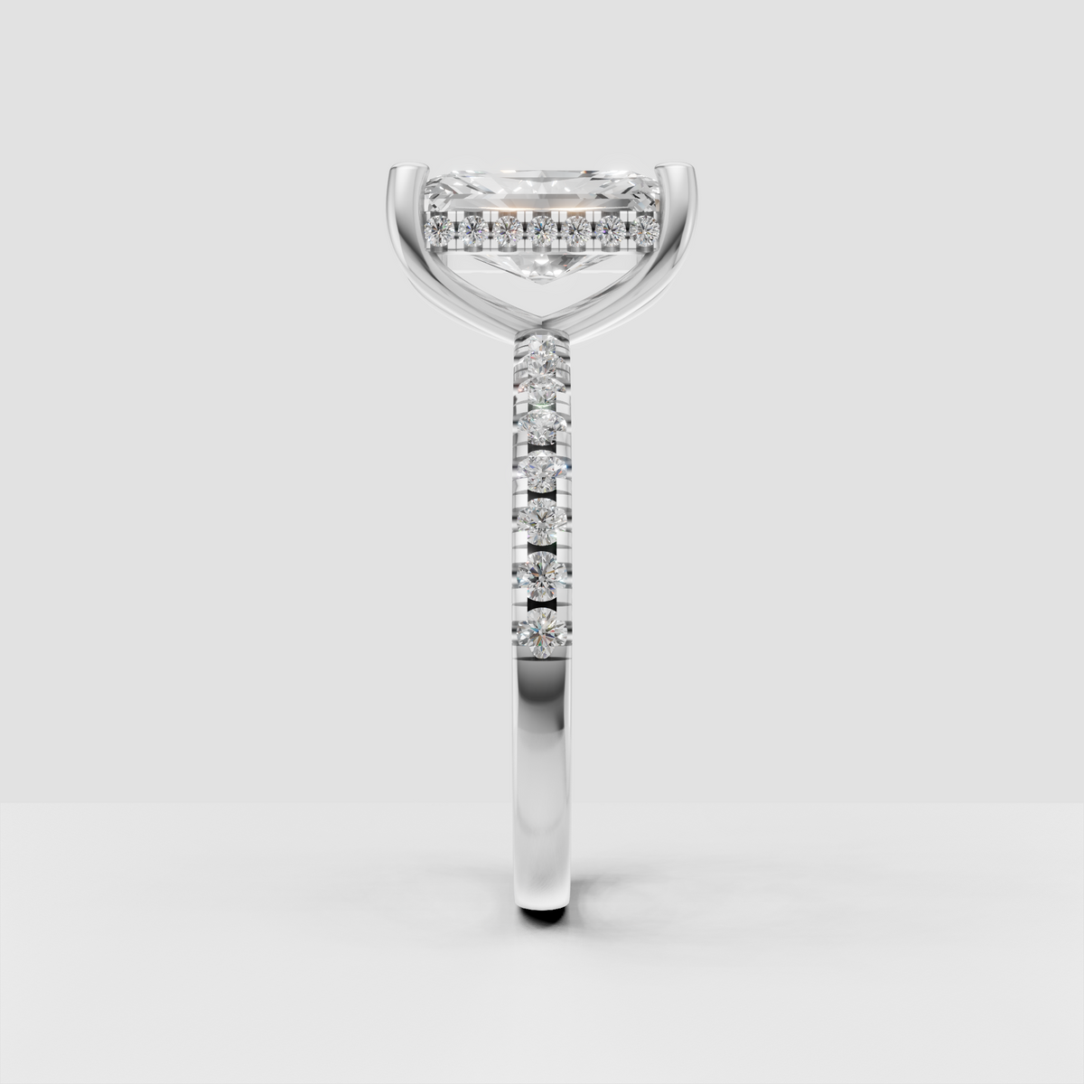 Radiant center diamond ring with sparkling pavé shoulders