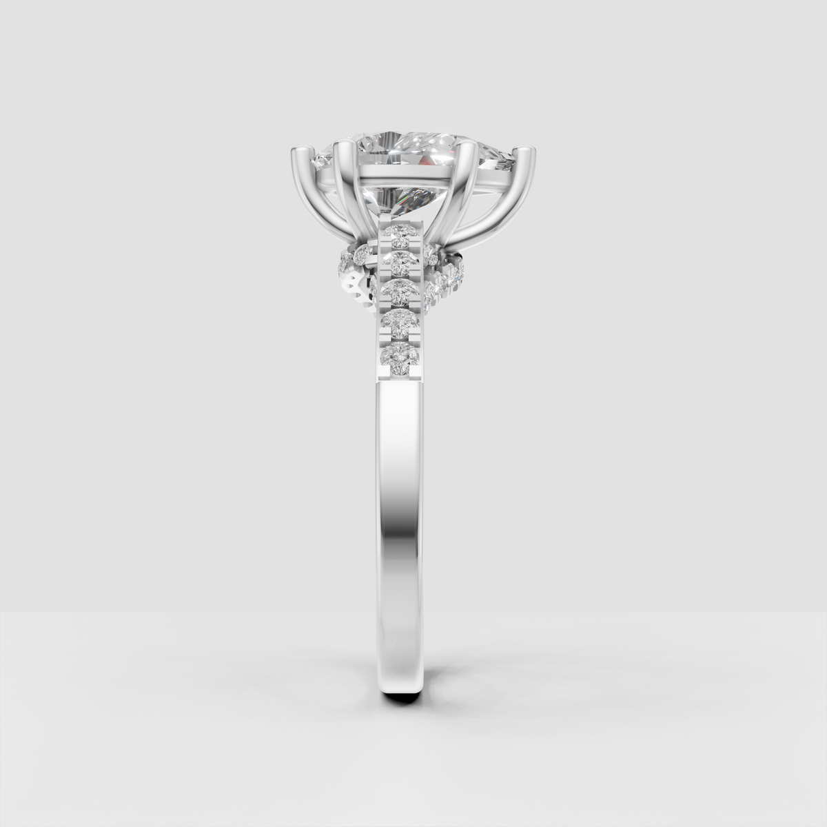 Pear diamond ring featuring a raised prong setting and split shank design
