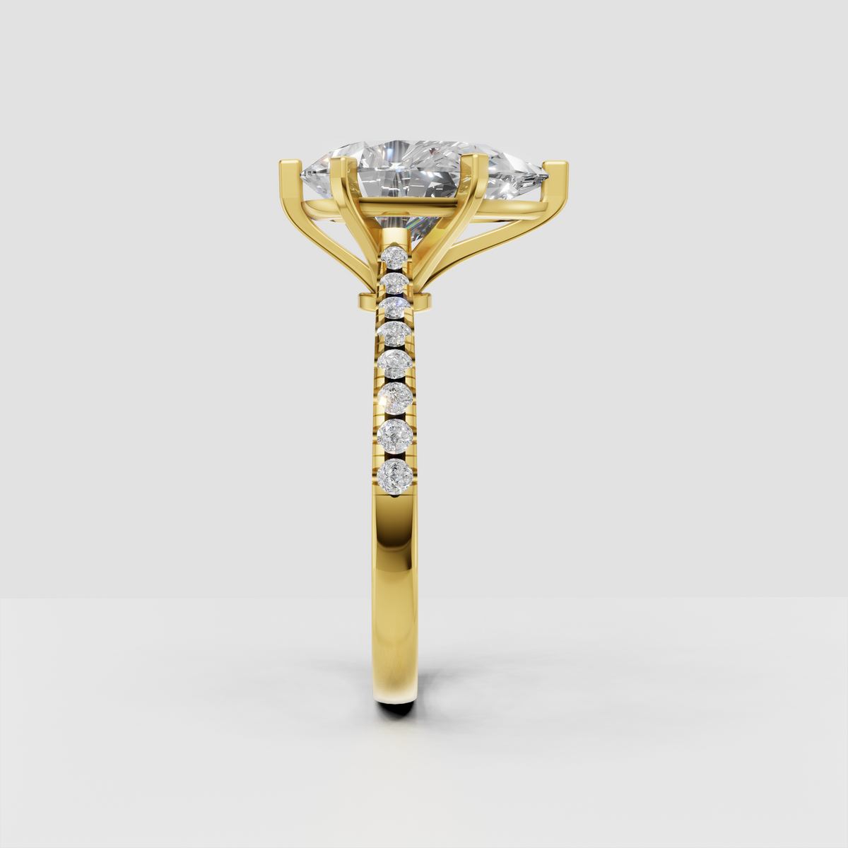 Pear shaped diamond solitaire ring with accent stones