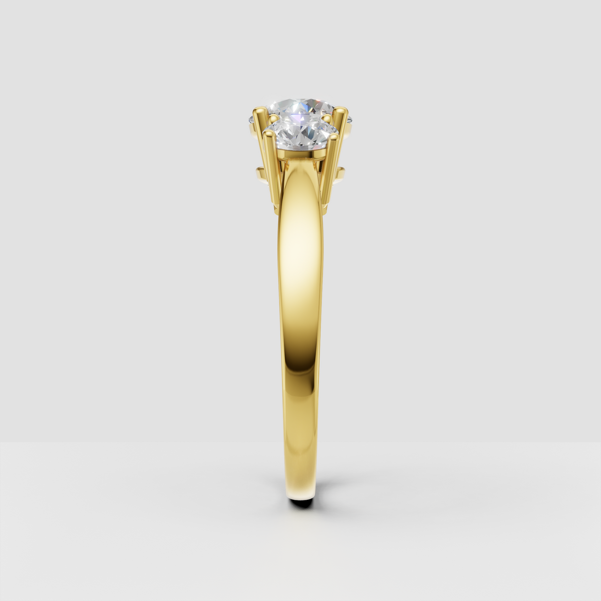 Yellow gold three-stone Diamond ring with classic prong setting