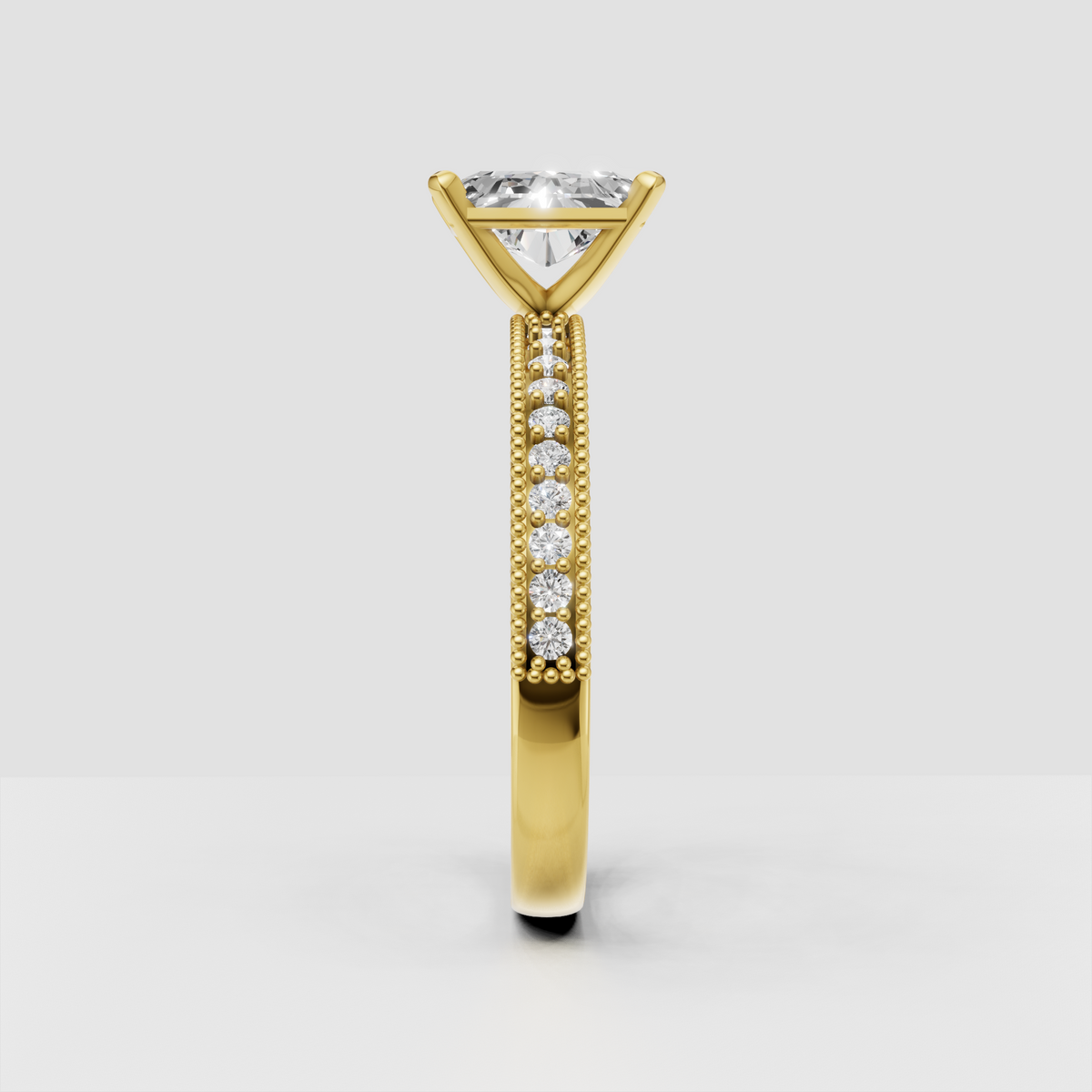 Gold radiant diamond engagement ring with sparkling diamond-accented shoulders